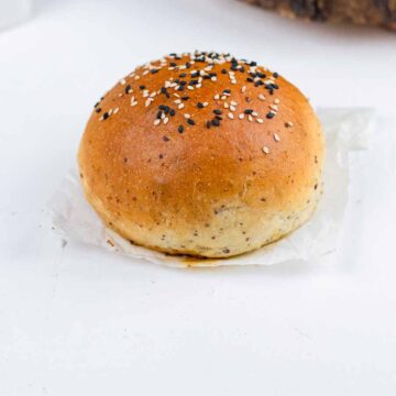 a vegan hamburger bun on the parchment paper