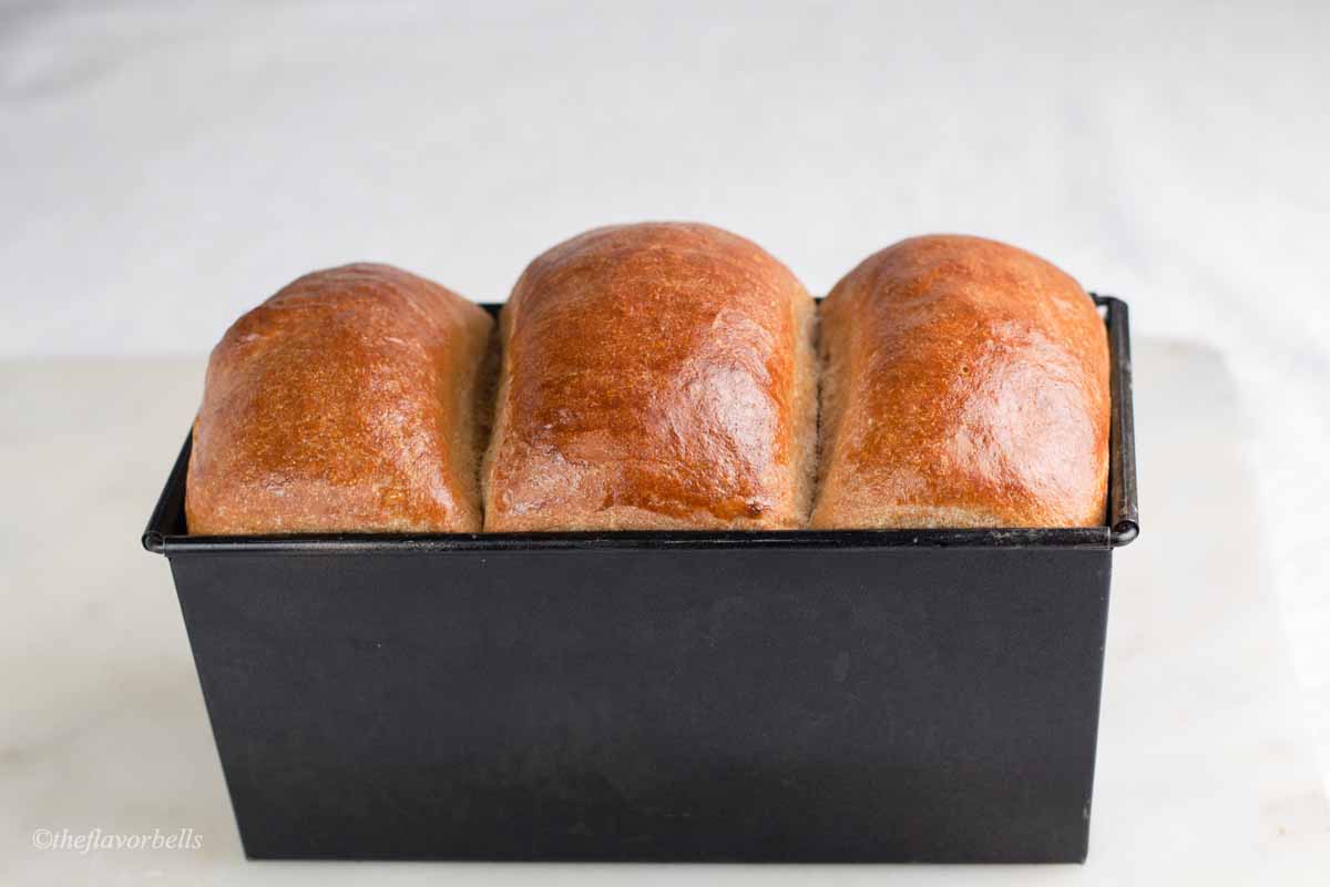 freshly baked vegan milk bread in a loaf pan