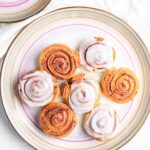 7 cinnamon rolls made in air fryer place in a plate