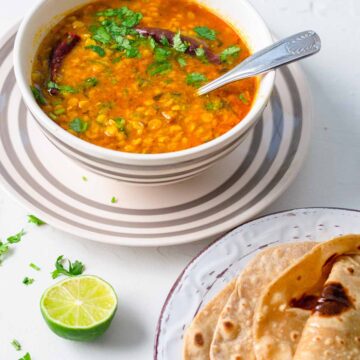 Chana dal made in instant pot, in a bowl with spoon