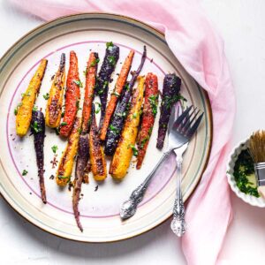 rainbow carrots that are being smoked and spiced to perfection