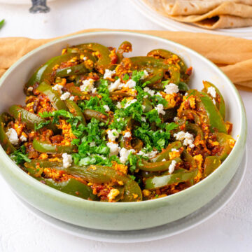shimla mirch ki sabzi with paneer in a bowl