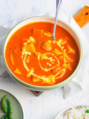 glorious creamy paneer butter masala topped with a swirl of heavy cream