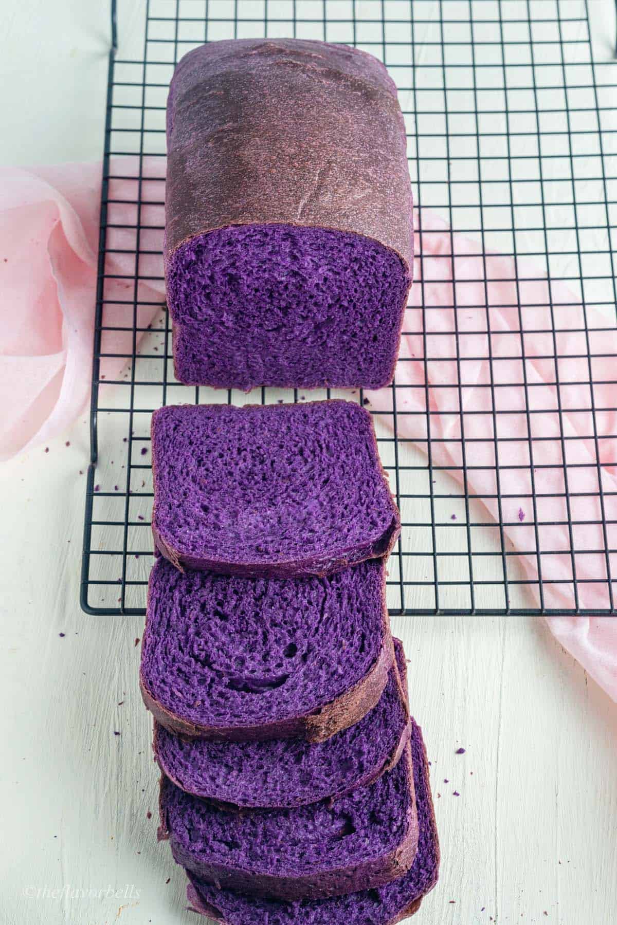 eggless ube milk bread slices to show the soft and tender crumbs