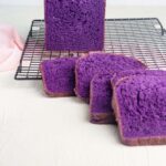 a loaf of ube bread with some slices