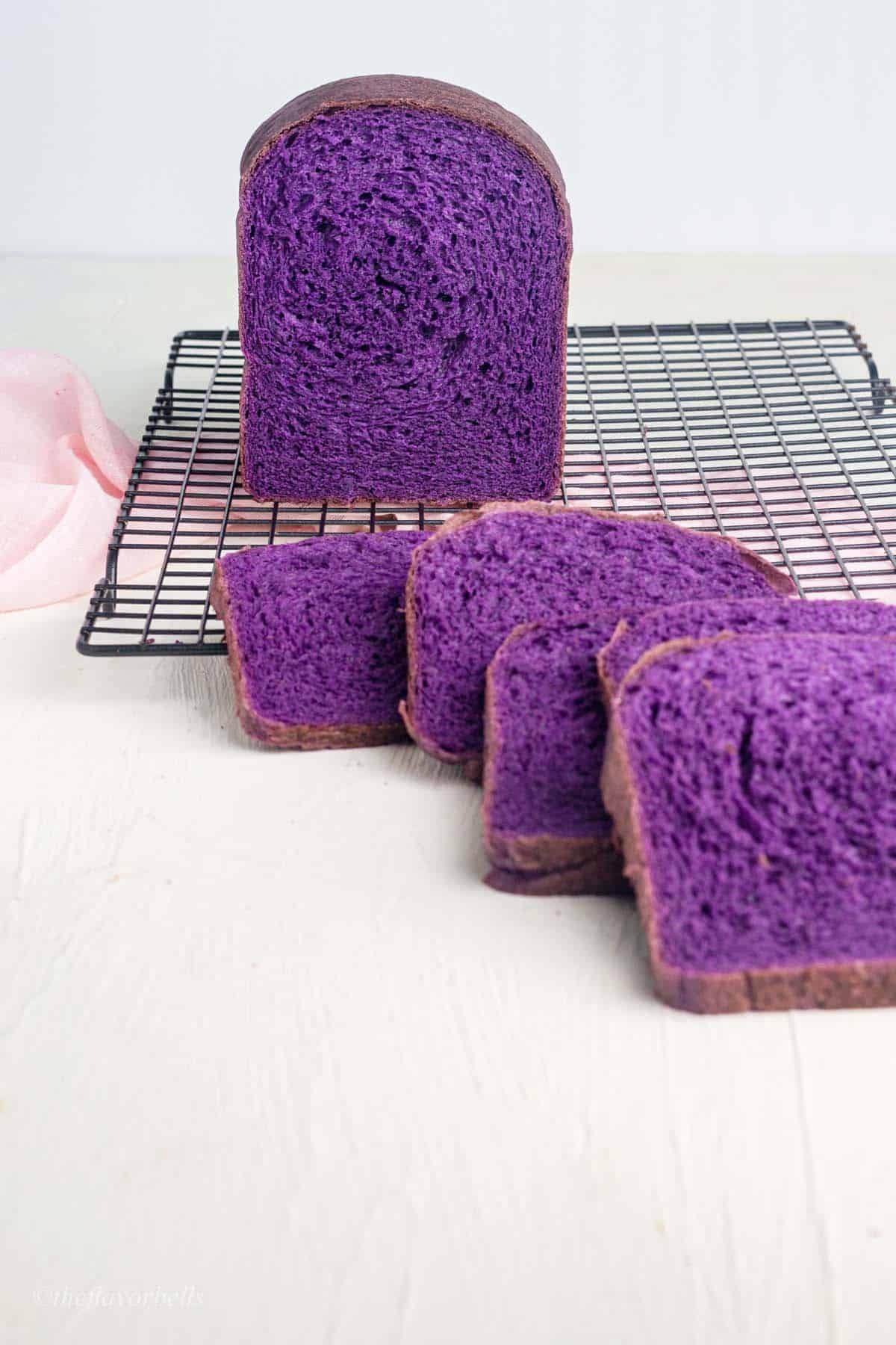 a loaf of ube bread with some slices