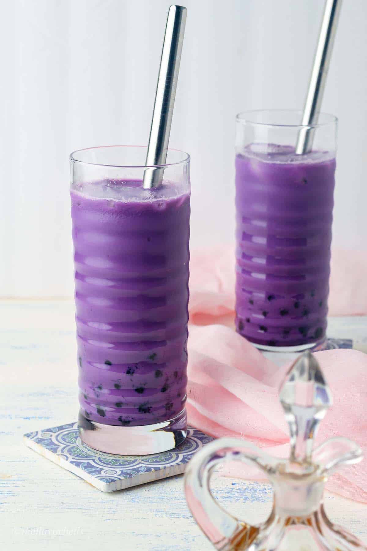 ube boba tea in two large glasses