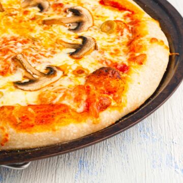 sourdough discard pizza in a pizza pan