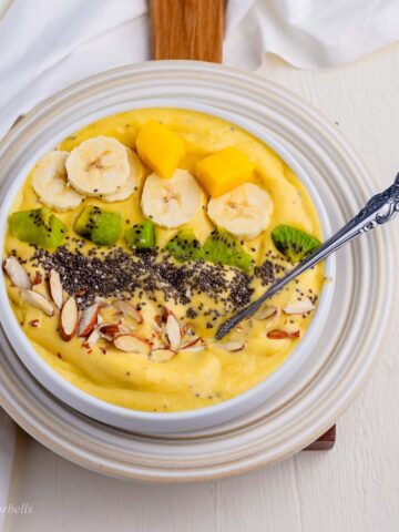 a large bowl of luscious and creamy mango smoothie