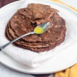 ragi roti piled one over another and drenched in desi ghee