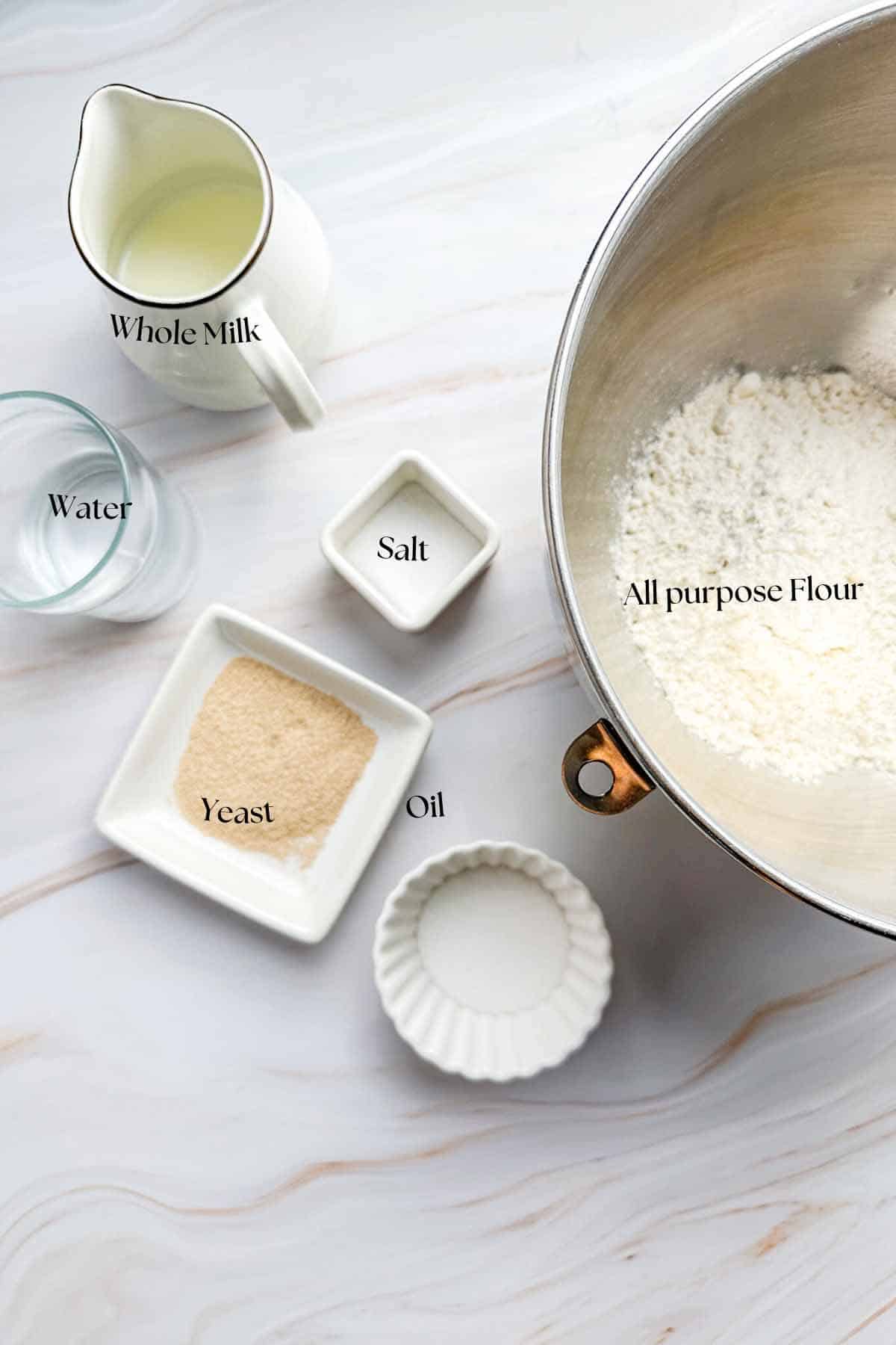 image showing all the ingredients required for making the garlic bread dough