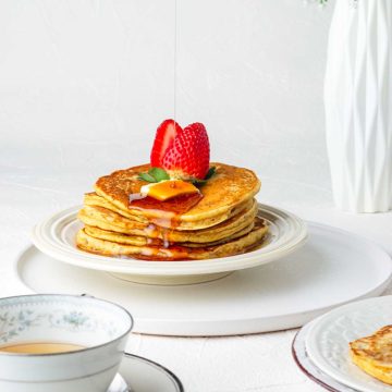 syrup dripping onto a stack of pumpkin pancakes
