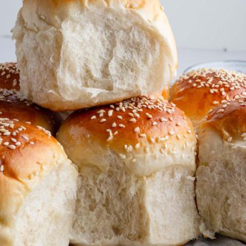 dinner rolls made up of sourdough discard being stacked one over other to give a better view of its crumb