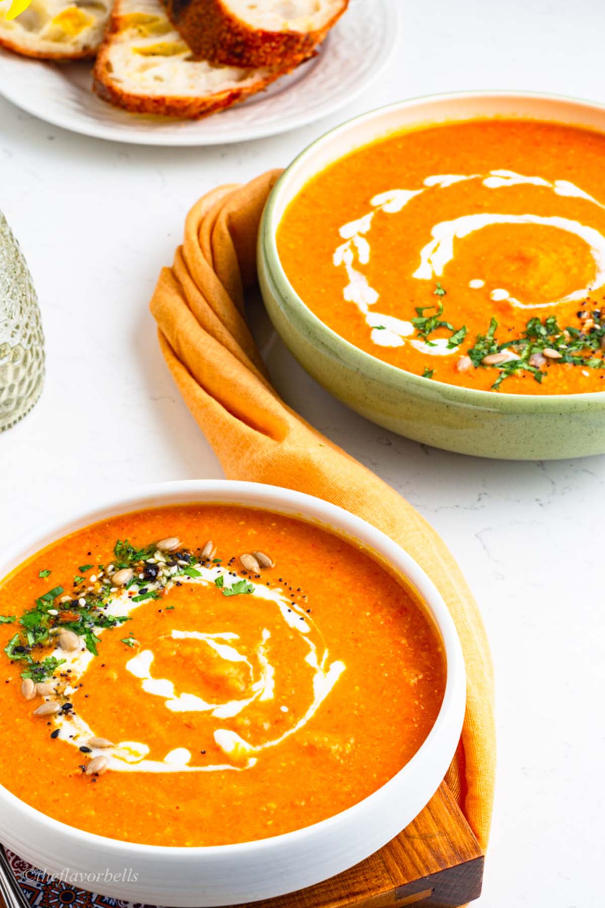 warm, cozy, and inviting bowls of orange and creamy soup.