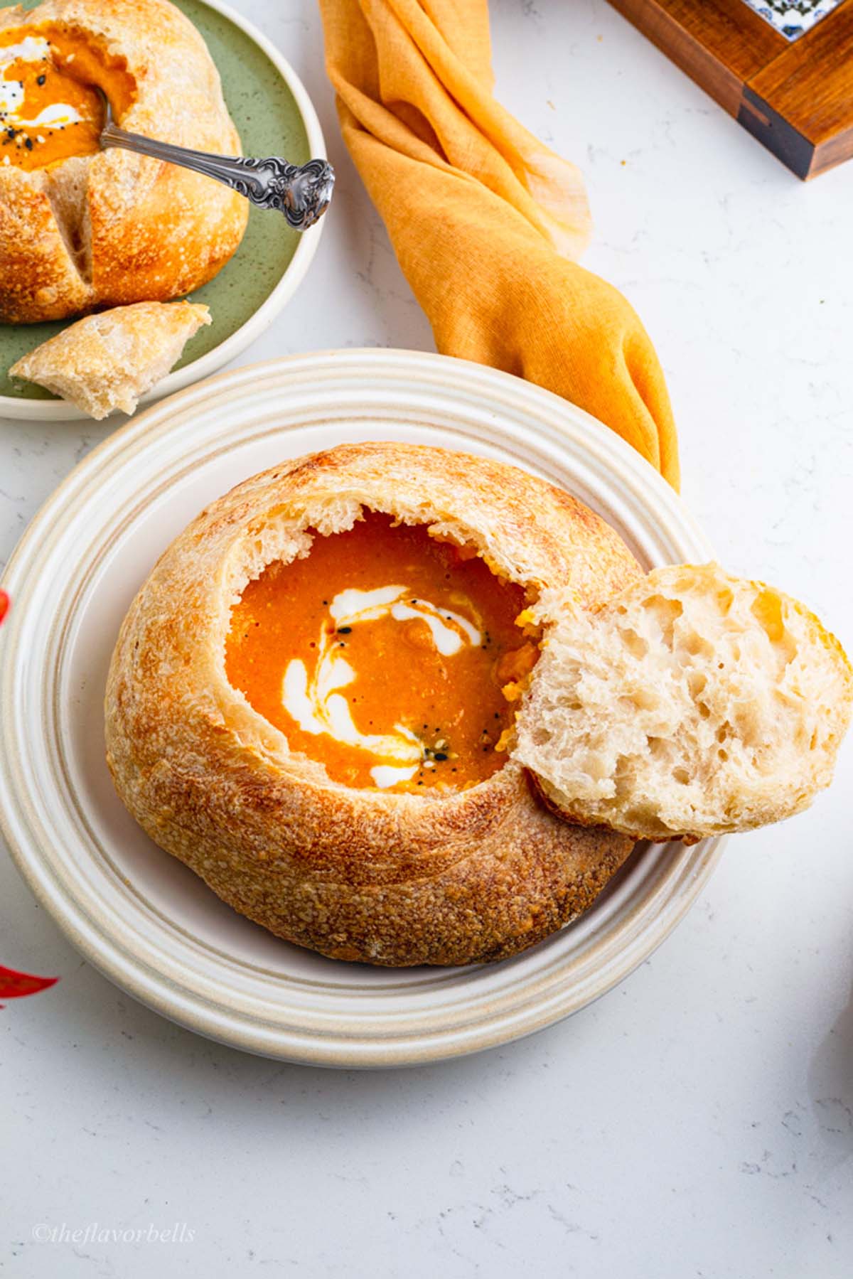am image showing a bread bowl filled with soup