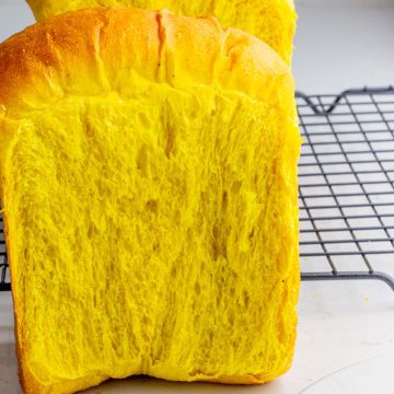 an up-close shot of the pullman loaf of the turmeric bread showing its crumb and lacy structure
