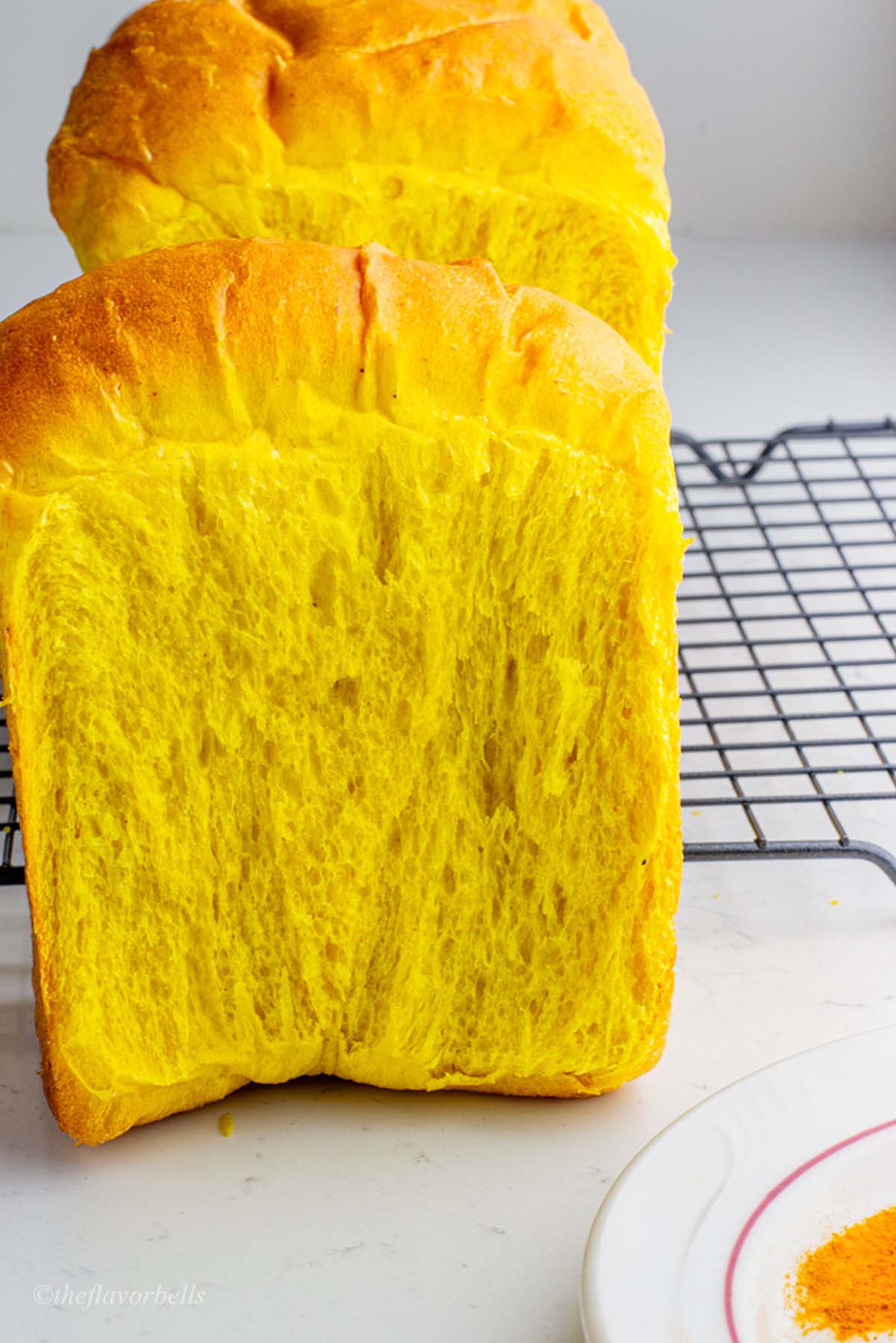 an up-close shot of the pullman loaf of the turmeric bread showing its crumb and lacy structure
