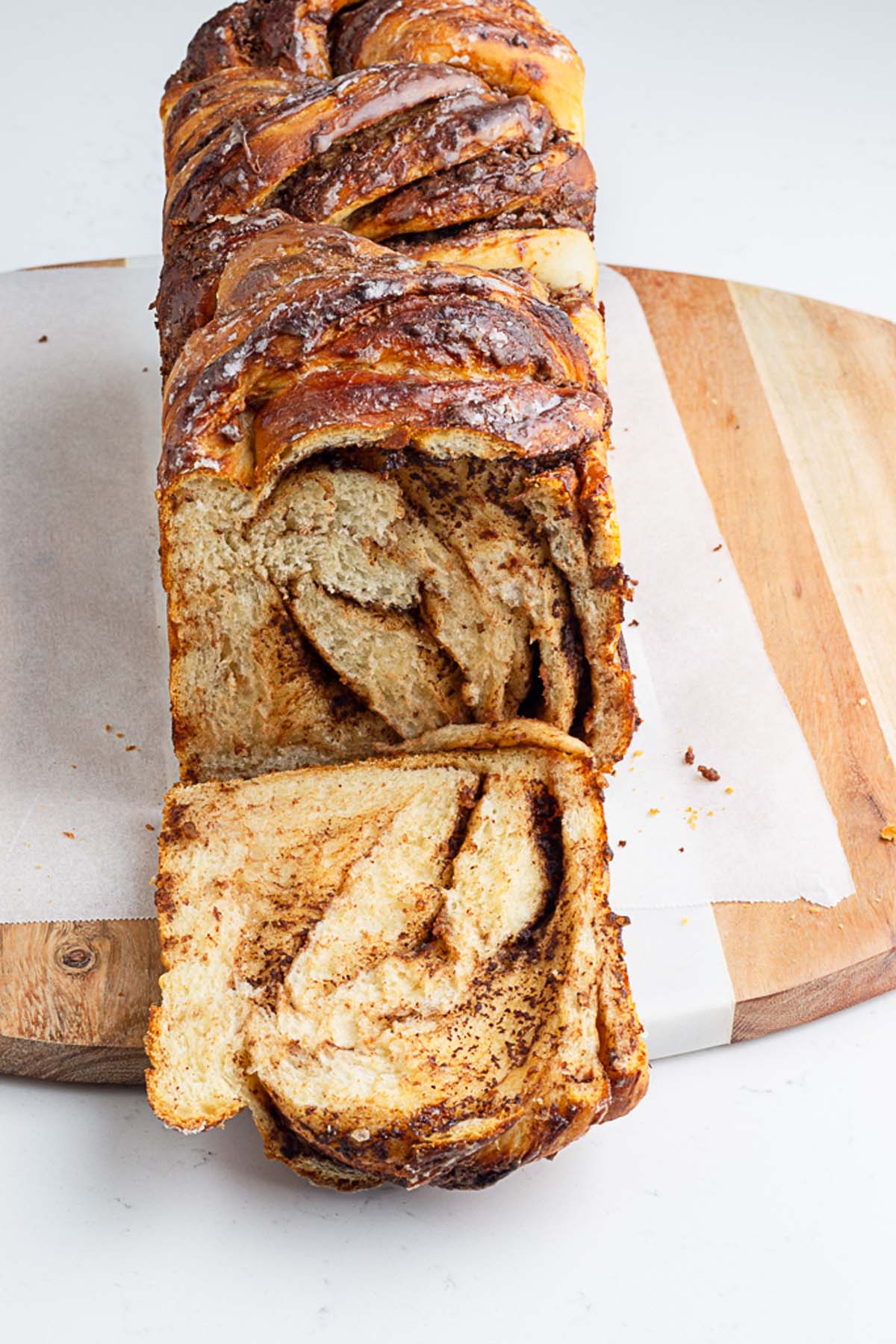 Nutella twist bread freshly baked and placed on a white serving board