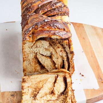 a loaf of Nutella babka sliced to show the swirls of Nutella