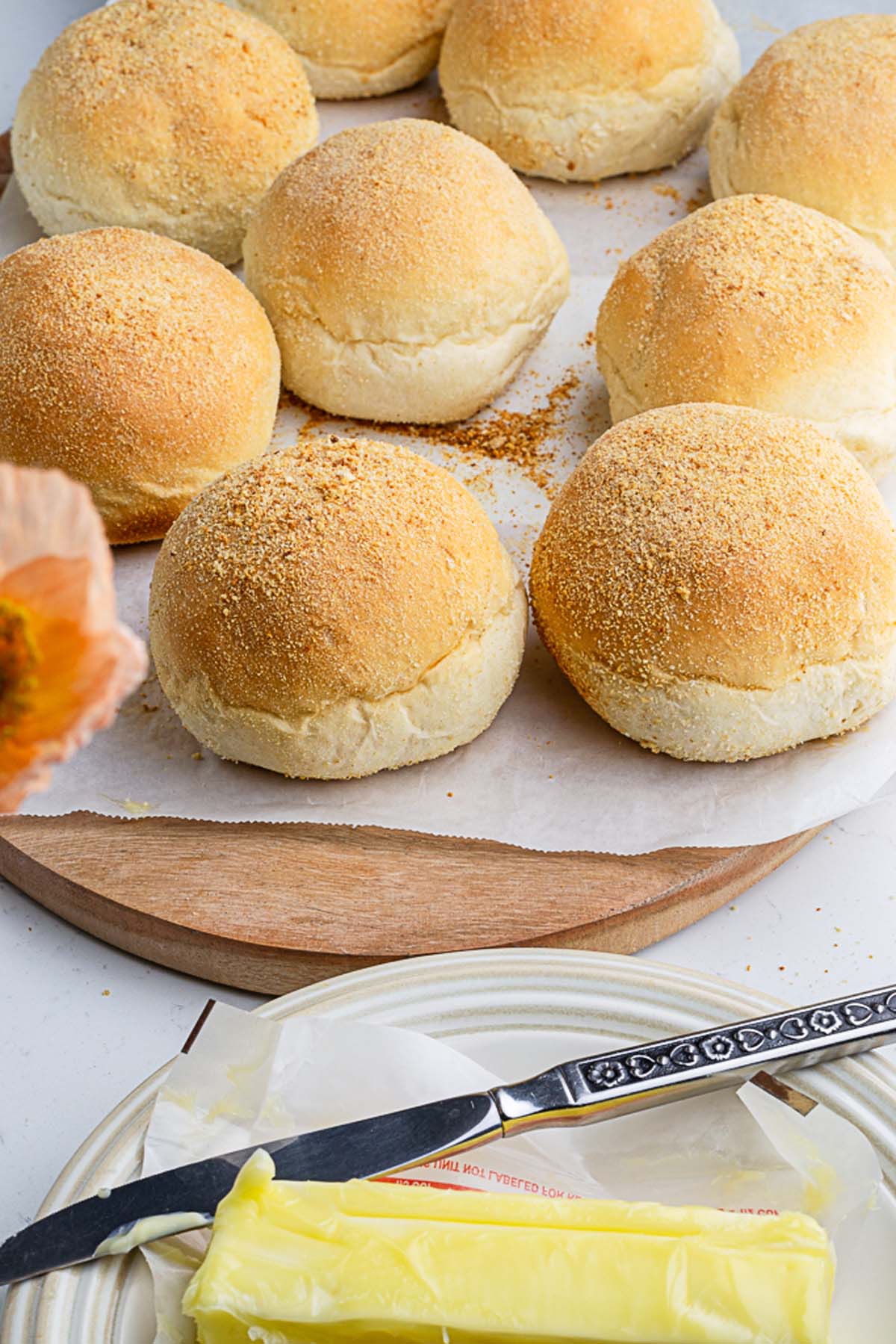 9 buns of egg free pandesal buns on a parchment paper