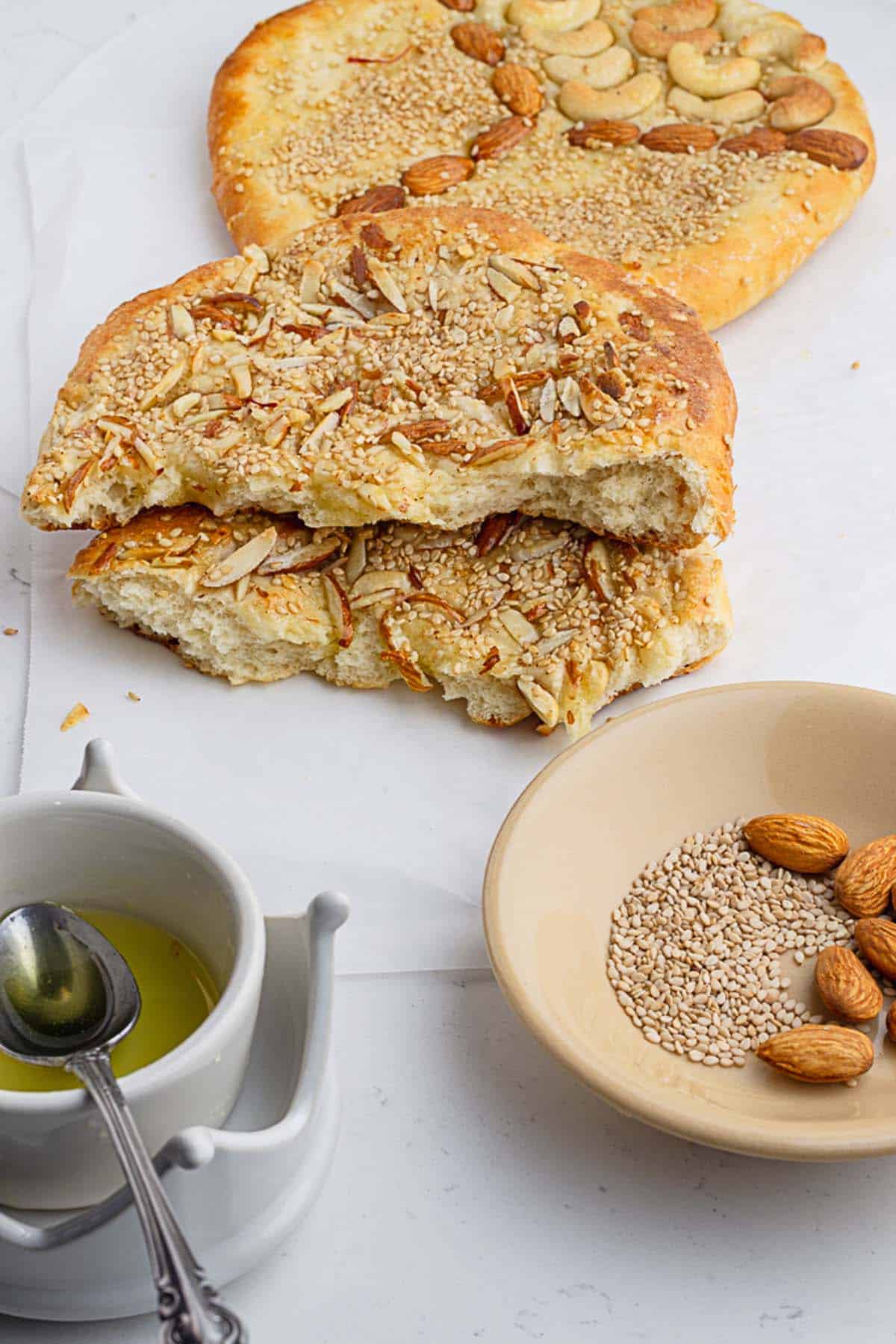 Broken up shirmal bread to show tender and syrup dunked crumbs