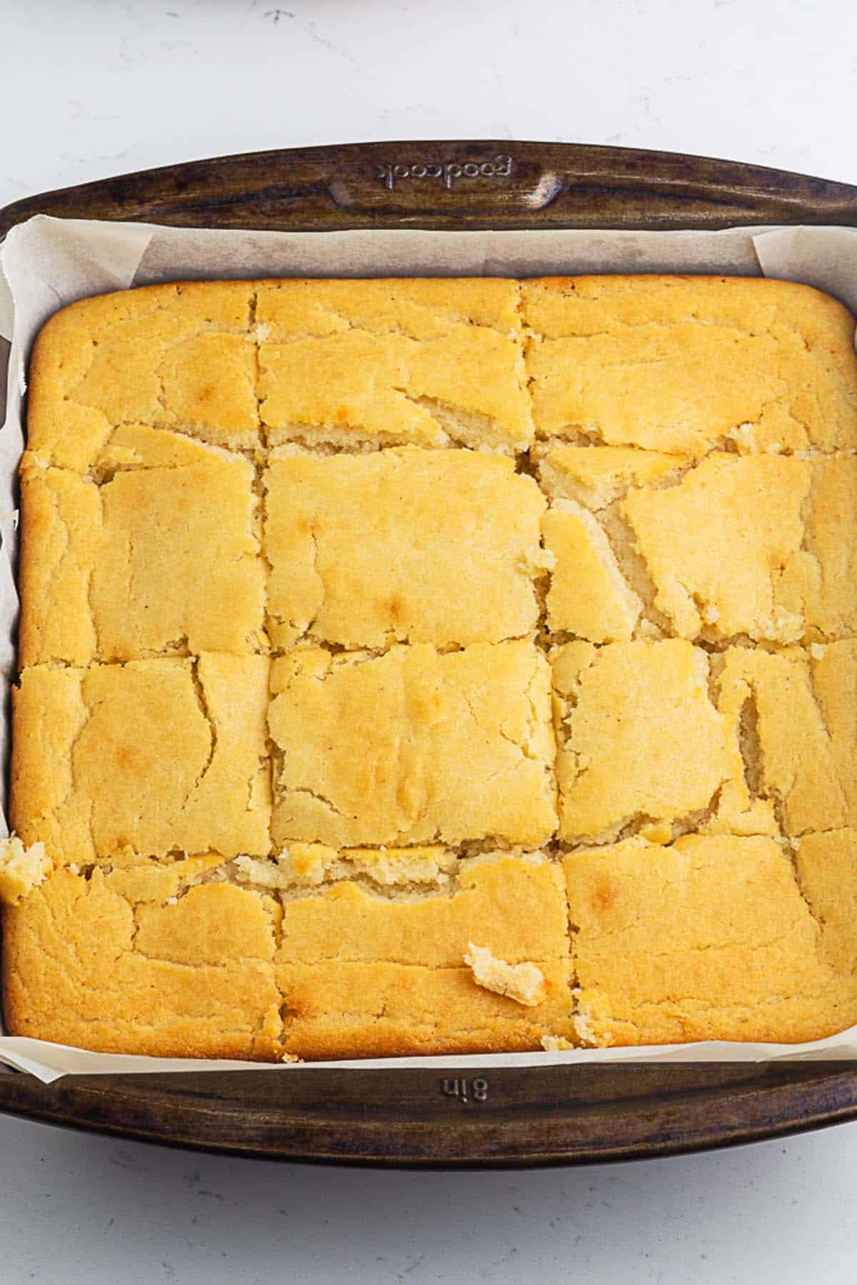 freshly baked cornbread in a square pan