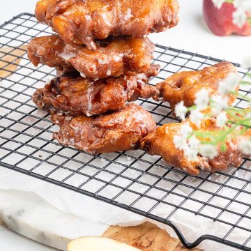 glossy and crunch looking apple fritters made from sourdough discard