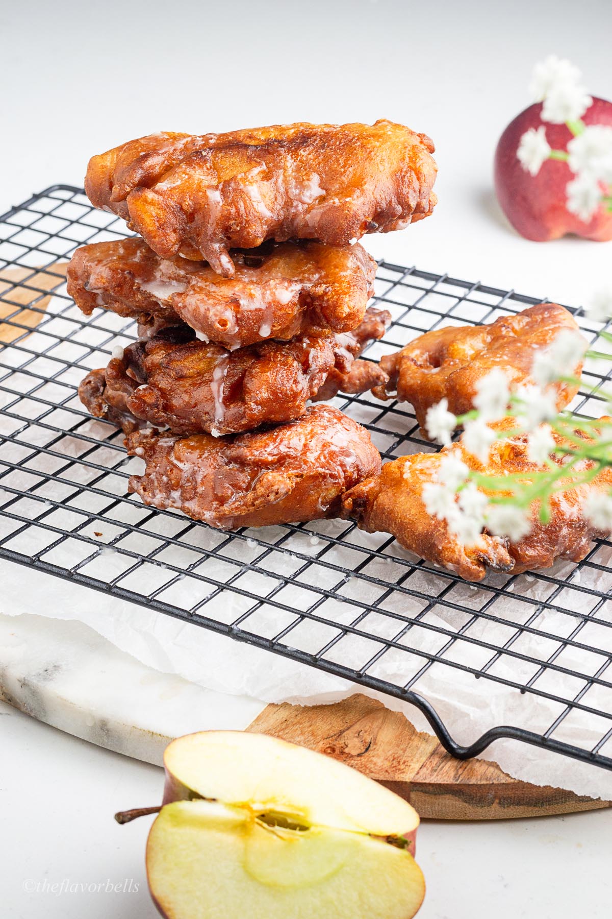 glossy and crunch looking apple fritters made from sourdough discard